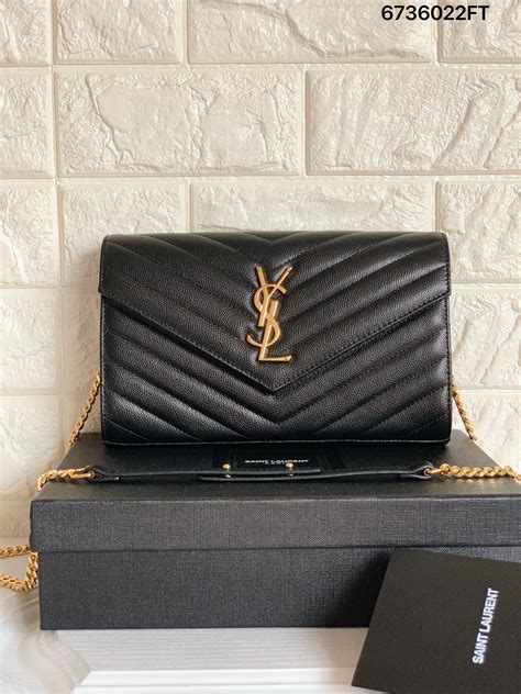 ysl clutch schwarz gold|ysl clutch price.